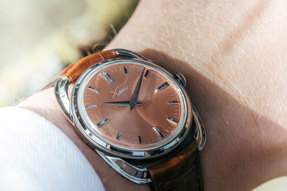 Xaviv Crablug 37 Salmon luxury dress watch wristshot, handcrafted in La Chaux-de-Fonds, Switzerland, featuring hand-wound movement and refined design aesthetics