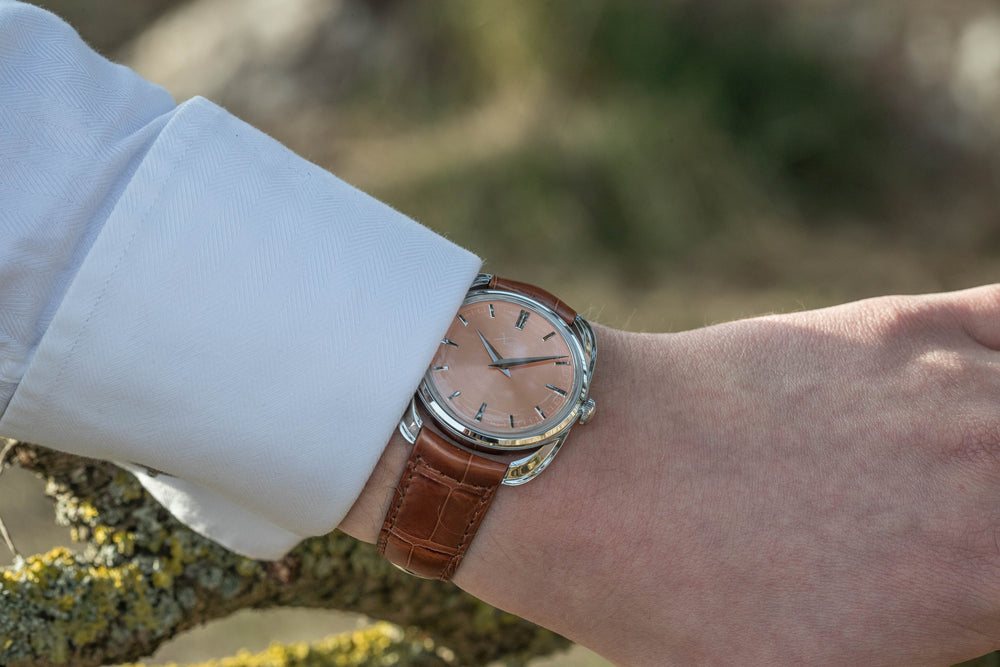 Xaviv Crablug 37 Salmon luxury dress watch wristshot, handcrafted in La Chaux-de-Fonds, Switzerland, featuring hand-wound movement and refined design aesthetics