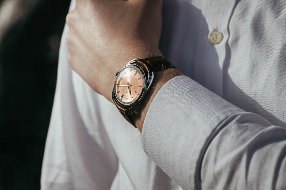 Xaviv Crablug 37 Salmon luxury dress watch wristshot, handcrafted in La Chaux-de-Fonds, Switzerland, featuring hand-wound movement and refined design aesthetics