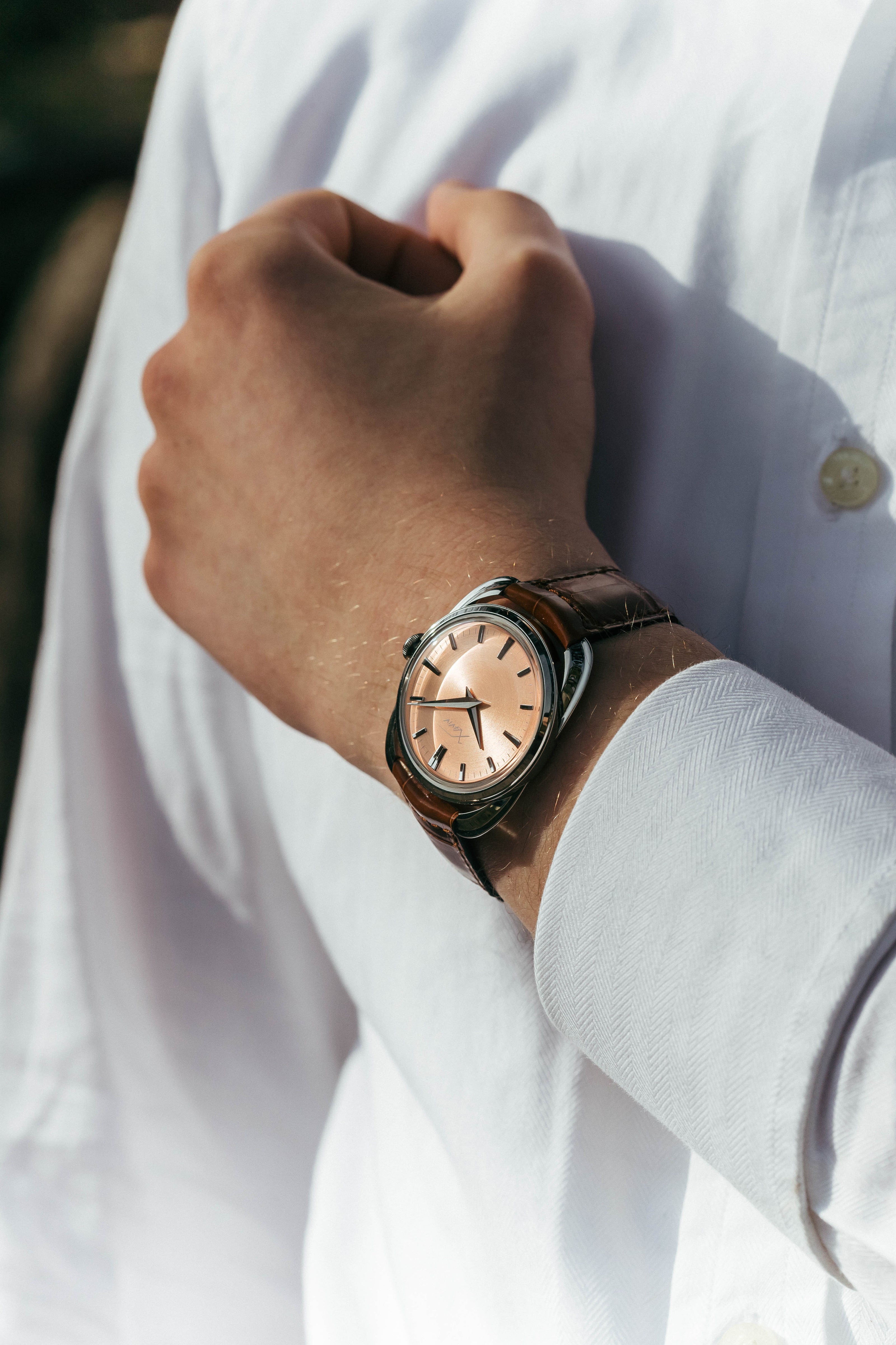 Xaviv Crablug 37 Salmon luxury dress watch wristshot, handcrafted in La Chaux-de-Fonds, Switzerland, featuring hand-wound movement and refined design aesthetics