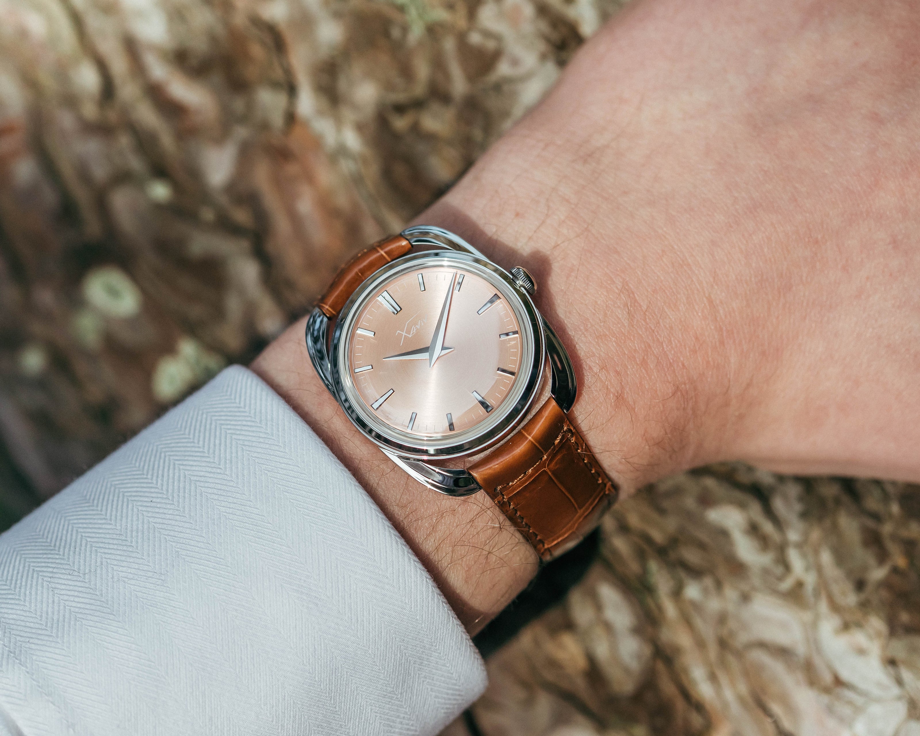 Xaviv Crablug 37 Salmon luxury dress watch wristshot, handcrafted in La Chaux-de-Fonds, Switzerland, featuring hand-wound movement and refined design aesthetics