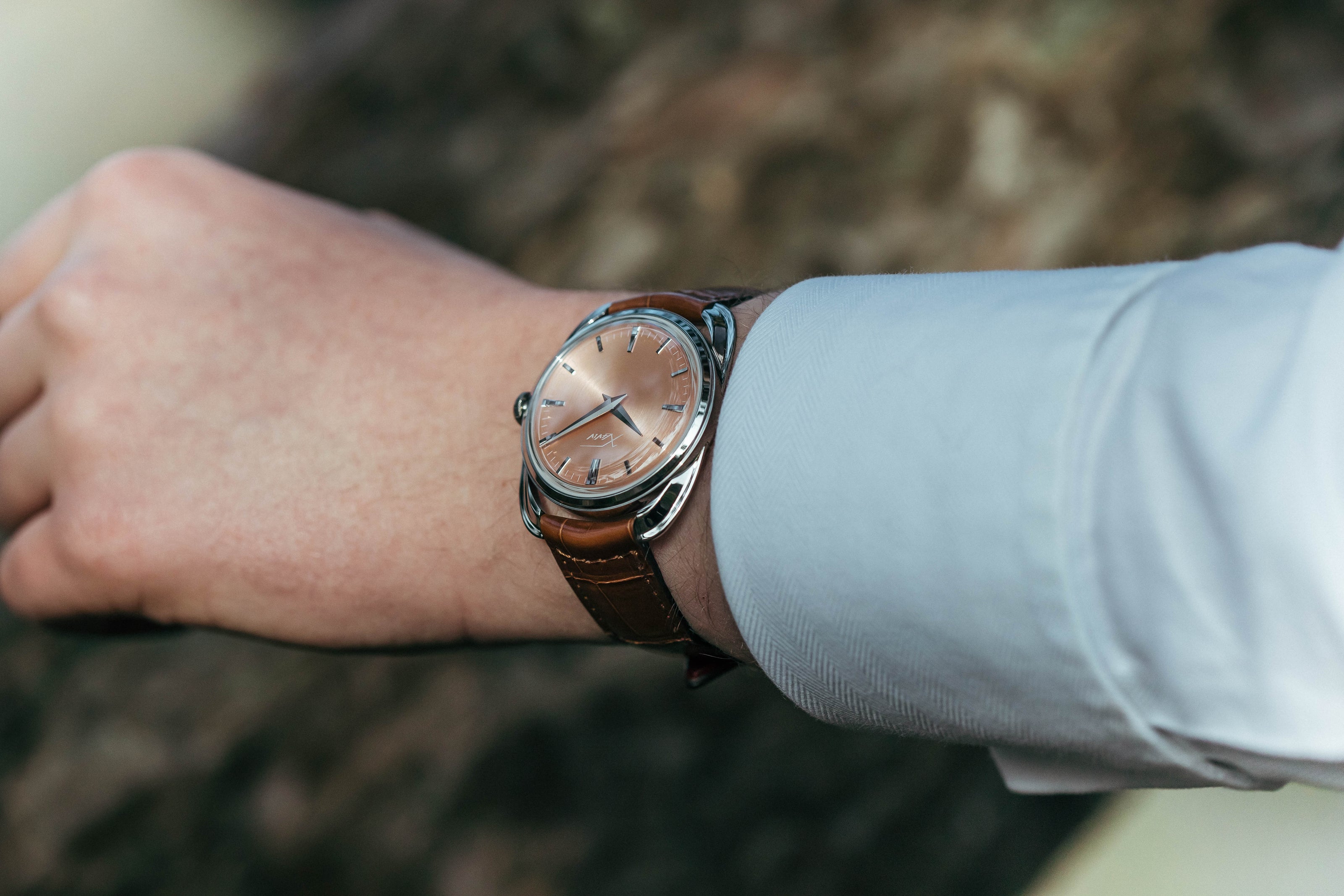 Xaviv Crablug 37 Salmon luxury dress watch wristshot, handcrafted in La Chaux-de-Fonds, Switzerland, featuring hand-wound movement and refined design aesthetics