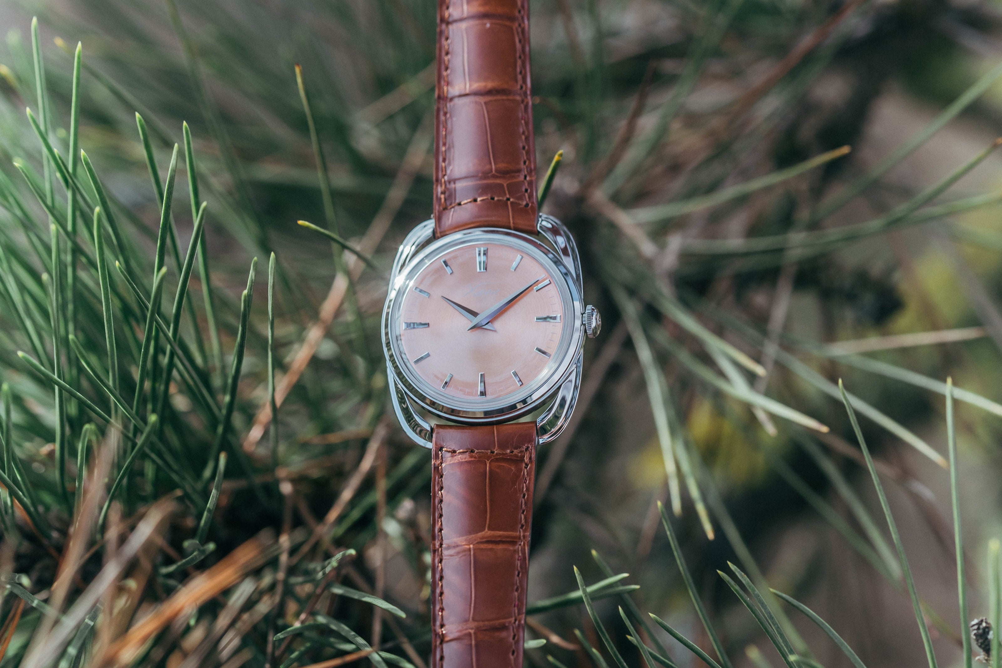 Xaviv Crablug 37 Salmon luxury dress watch in nature, handcrafted in La Chaux-de-Fonds, Switzerland, featuring hand-wound movement and refined design aesthetics