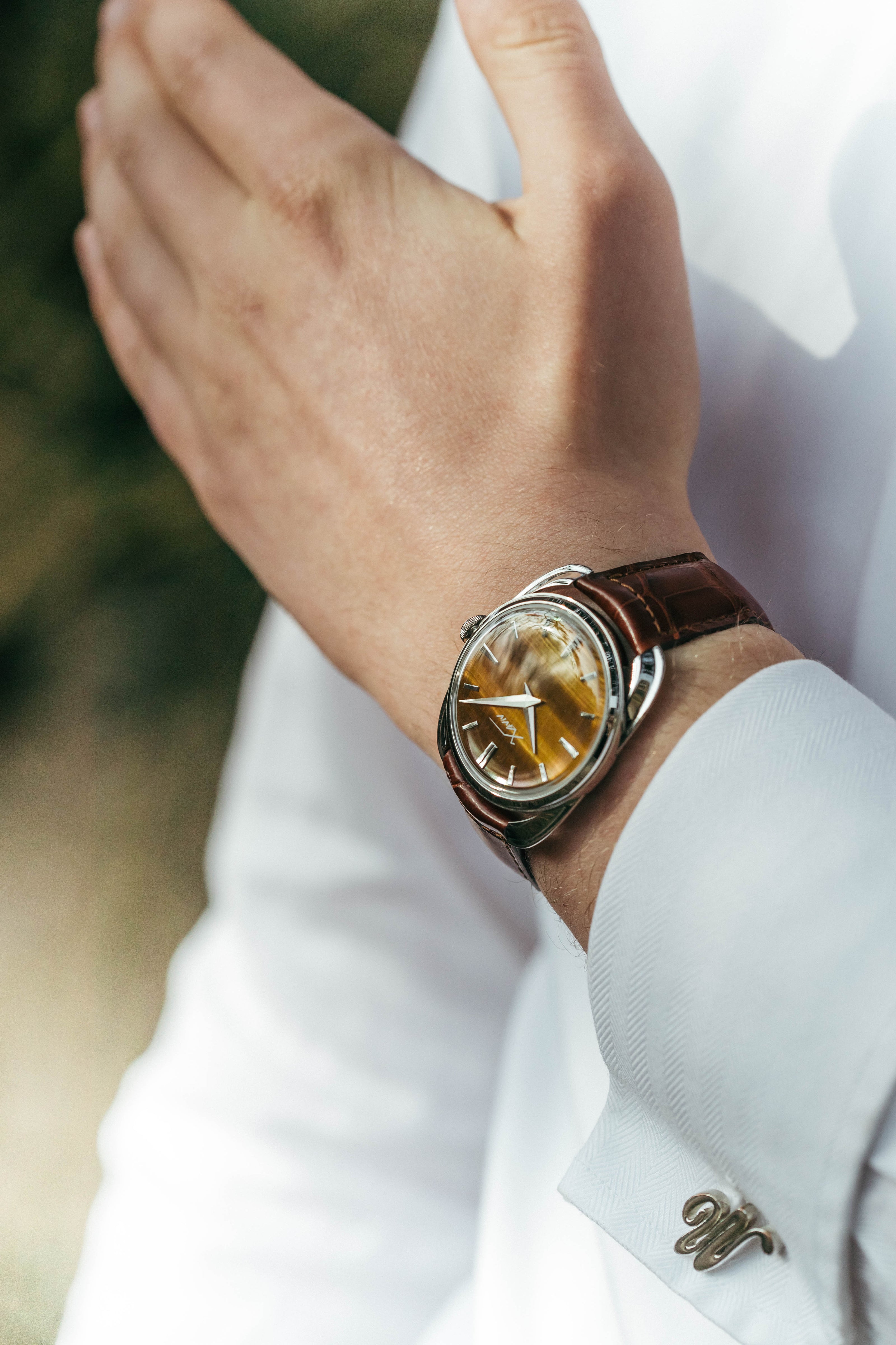Xaviv Crablug 37 Tiger Eye Stone Dialluxury dress watch wristshot, handcrafted in La Chaux-de-Fonds, Switzerland, featuring hand-wound movement and refined design aesthetics
