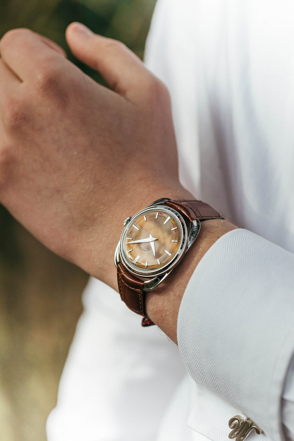 Xaviv Crablug 37 Tiger Eye Stone Dialluxury dress watch wristshot, handcrafted in La Chaux-de-Fonds, Switzerland, featuring hand-wound movement and refined design aesthetics