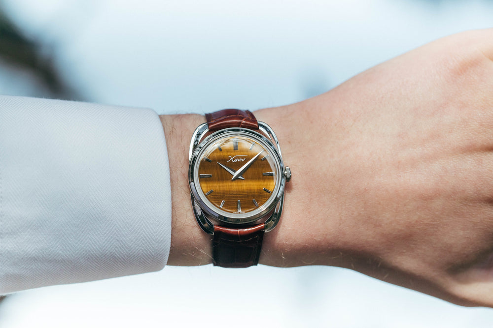 Xaviv Crablug 37 Tiger Eye Stone Dialluxury dress watch wristshot, handcrafted in La Chaux-de-Fonds, Switzerland, featuring hand-wound movement and refined design aesthetics