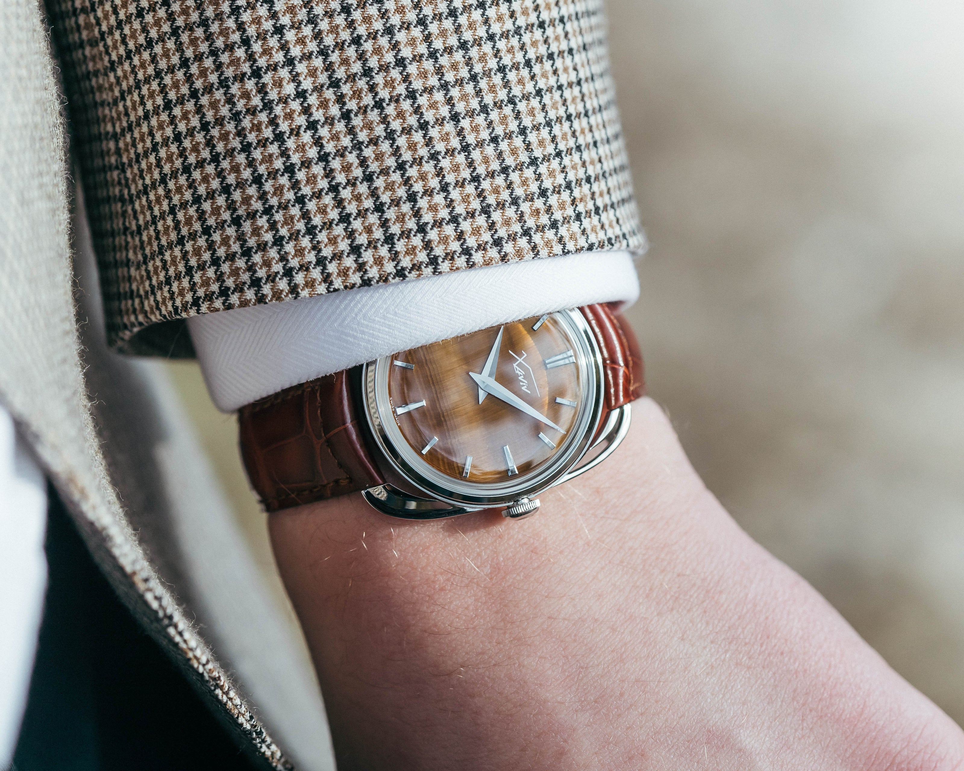 Xaviv Crablug 37 Tiger Eye Stone Dialluxury dress watch wristshot, handcrafted in La Chaux-de-Fonds, Switzerland, featuring hand-wound movement and refined design aesthetics