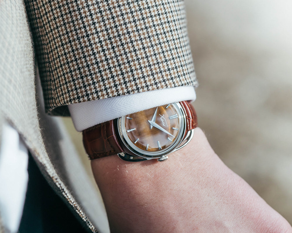 Xaviv Crablug 37 Tiger Eye Stone Dialluxury dress watch wristshot, handcrafted in La Chaux-de-Fonds, Switzerland, featuring hand-wound movement and refined design aesthetics