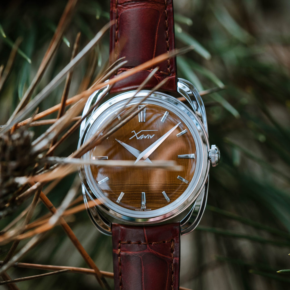 Xaviv Crablug 37 Tiger Eye Stone Dialluxury dress watch in nature, handcrafted in La Chaux-de-Fonds, Switzerland, featuring hand-wound movement and refined design aesthetics