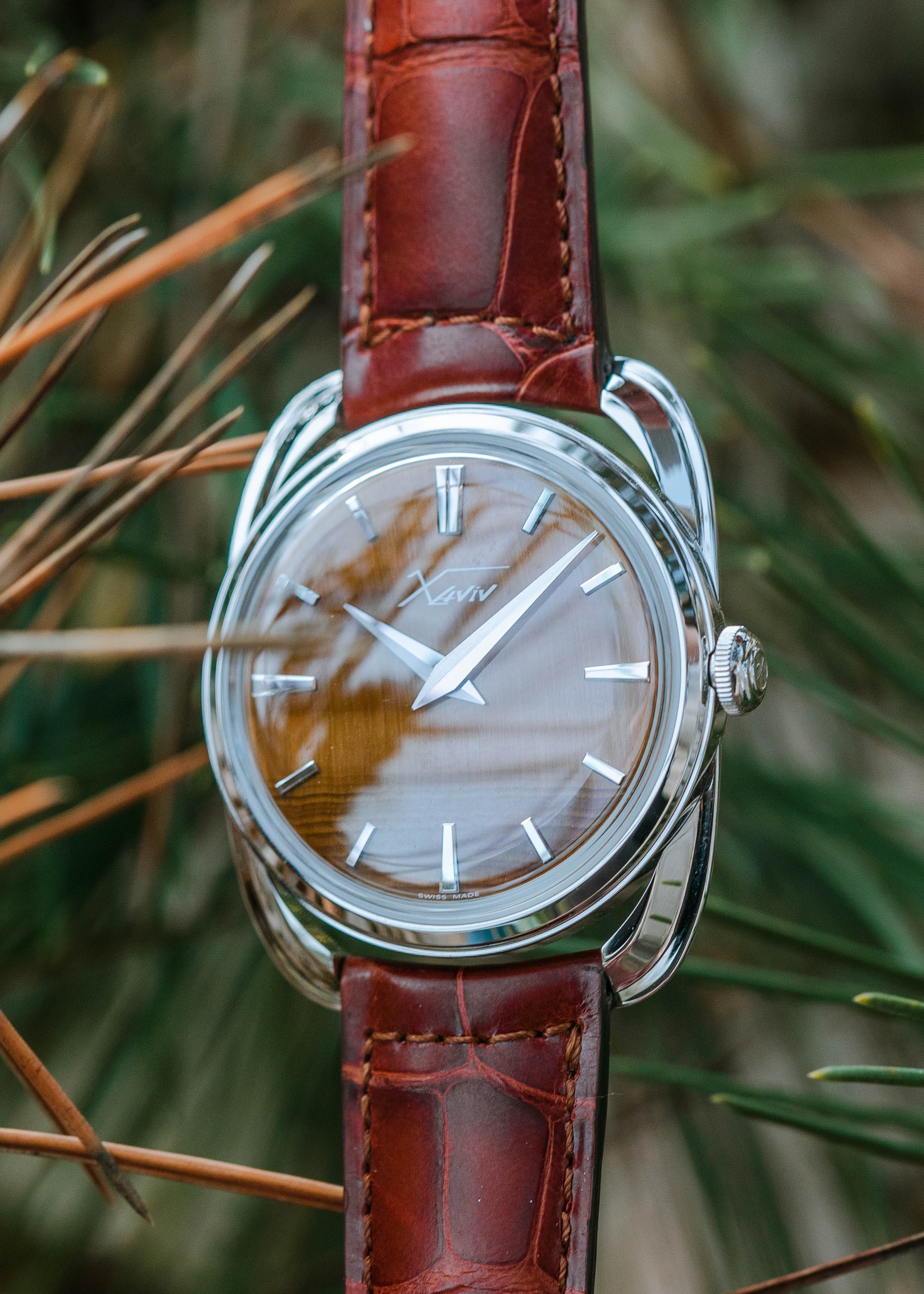 Xaviv Crablug 37 Tiger Eye Stone Dialluxury dress watch wristshot, handcrafted in La Chaux-de-Fonds, Switzerland, featuring hand-wound movement and refined design aesthetics