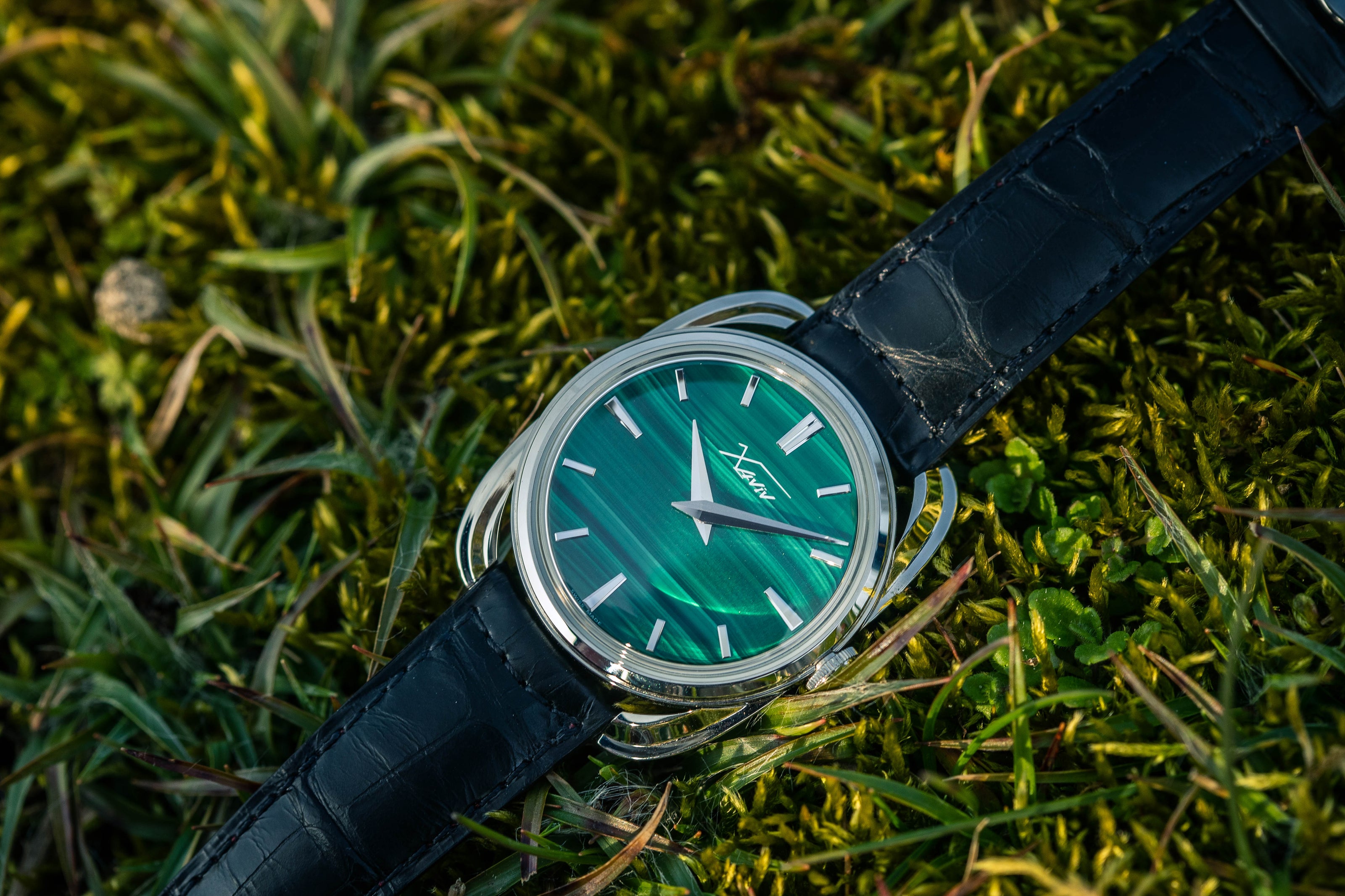 Xaviv Crablug 37 Malachite Stone Dialluxury dress watch wristshot, handcrafted in La Chaux-de-Fonds, Switzerland, featuring hand-wound movement and refined design aesthetics