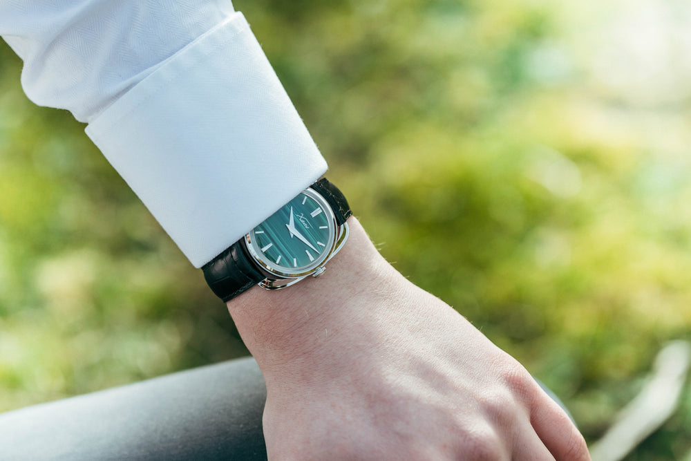 Xaviv Crablug 37 Malachite Stone Dialluxury dress watch wristshot, handcrafted in La Chaux-de-Fonds, Switzerland, featuring hand-wound movement and refined design aesthetics
