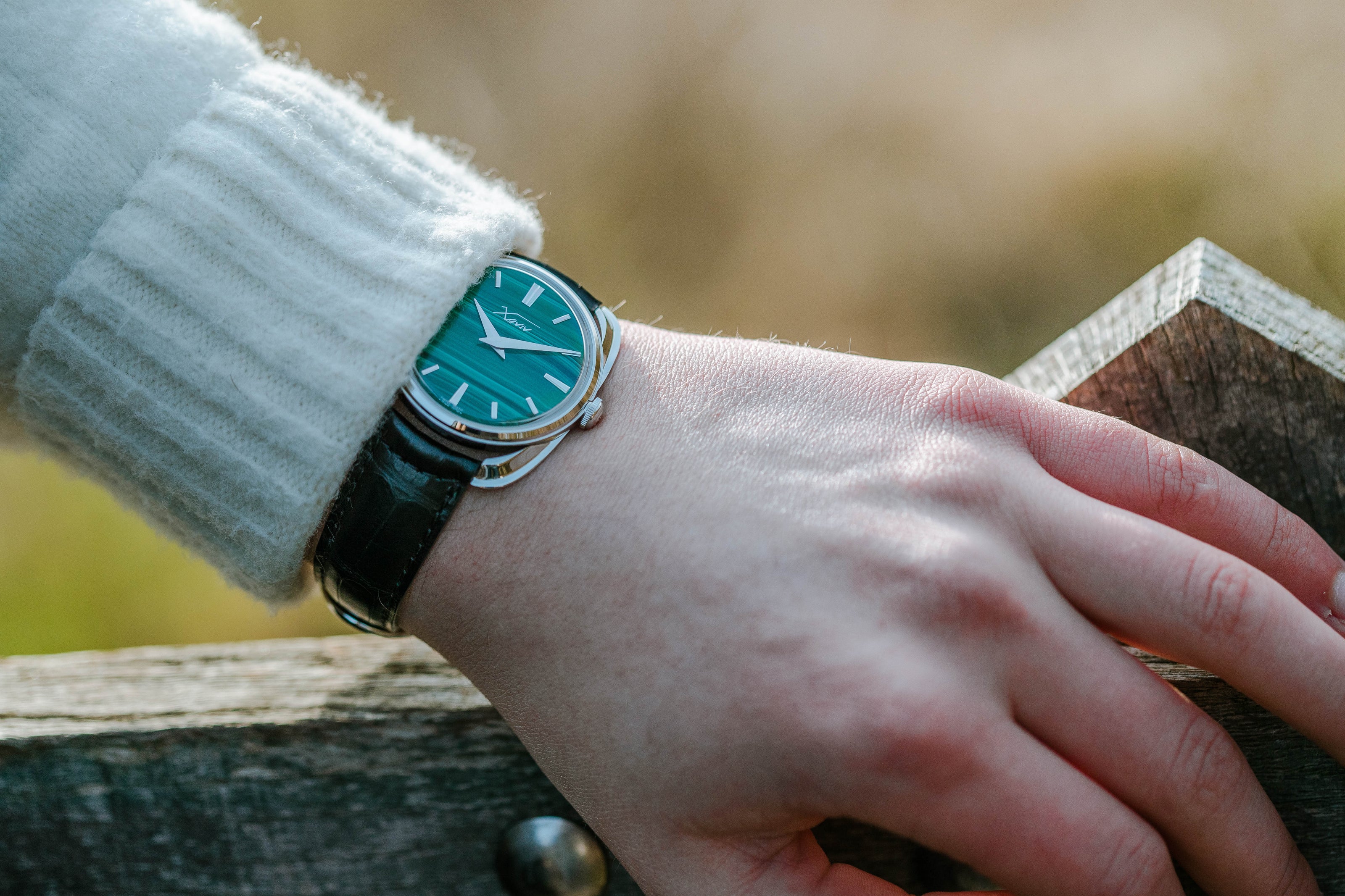 Xaviv Crablug 37 Malachite Stone Dialluxury dress watch wristshot, handcrafted in La Chaux-de-Fonds, Switzerland, featuring hand-wound movement and refined design aesthetics